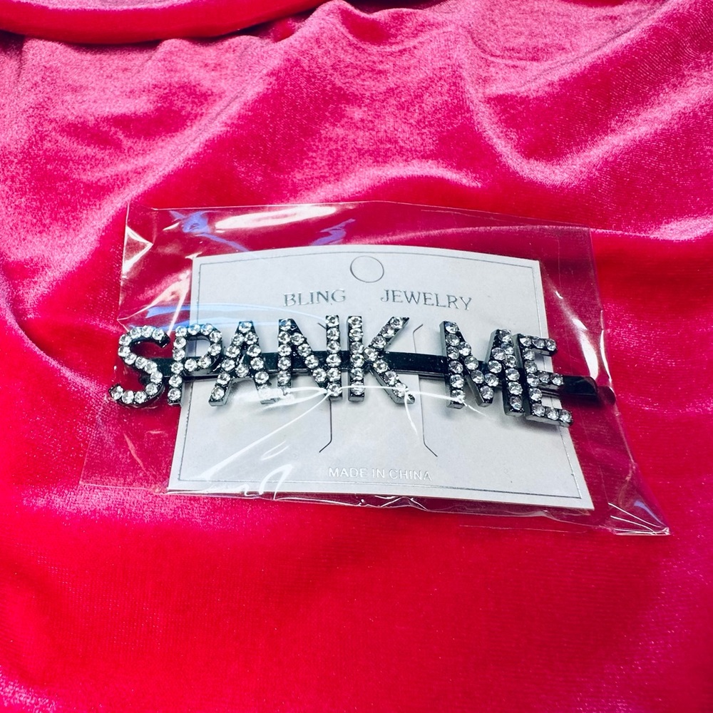 “SPANK ME” rhinestone hair pin from TIGRIS NEW YORK
